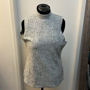 Sleeveless zip back turtleneck